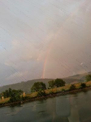 rainbow over the river rhone in france
